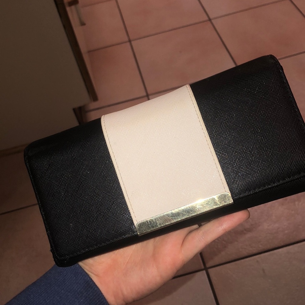Black and off-white wallet with gold accents